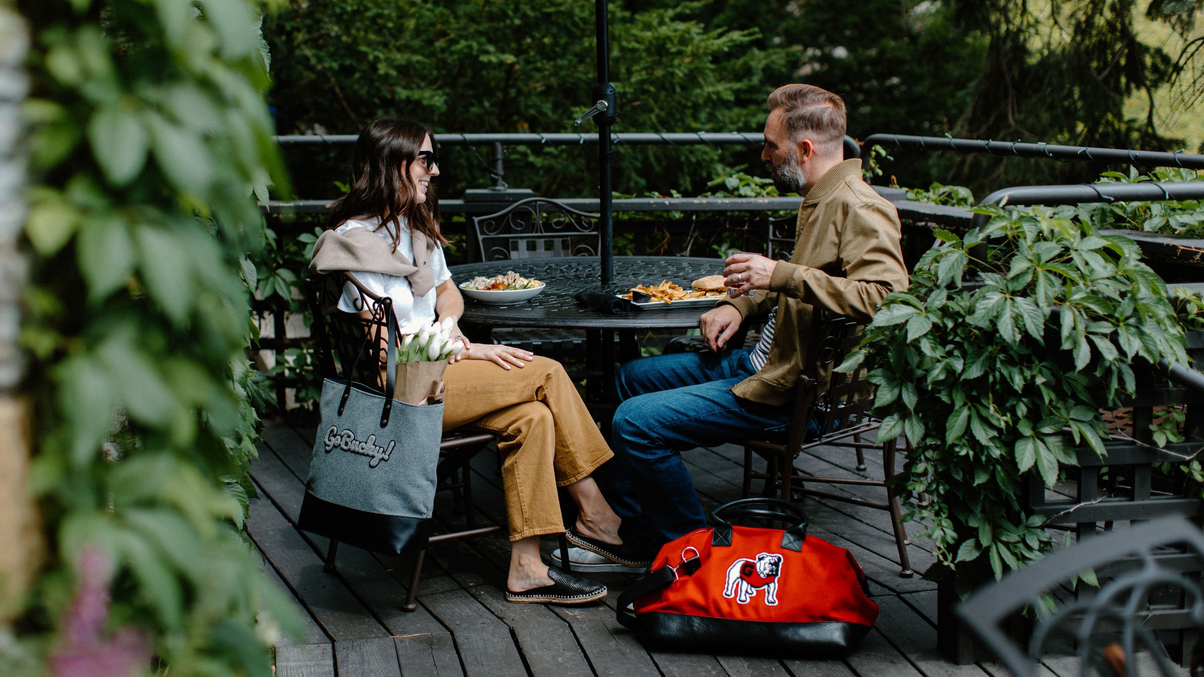 people dining on a patio with wool bags from heritage gear