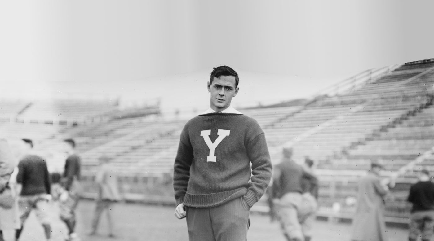 Black and white photo of 1940's sports fan in "Y" sweater